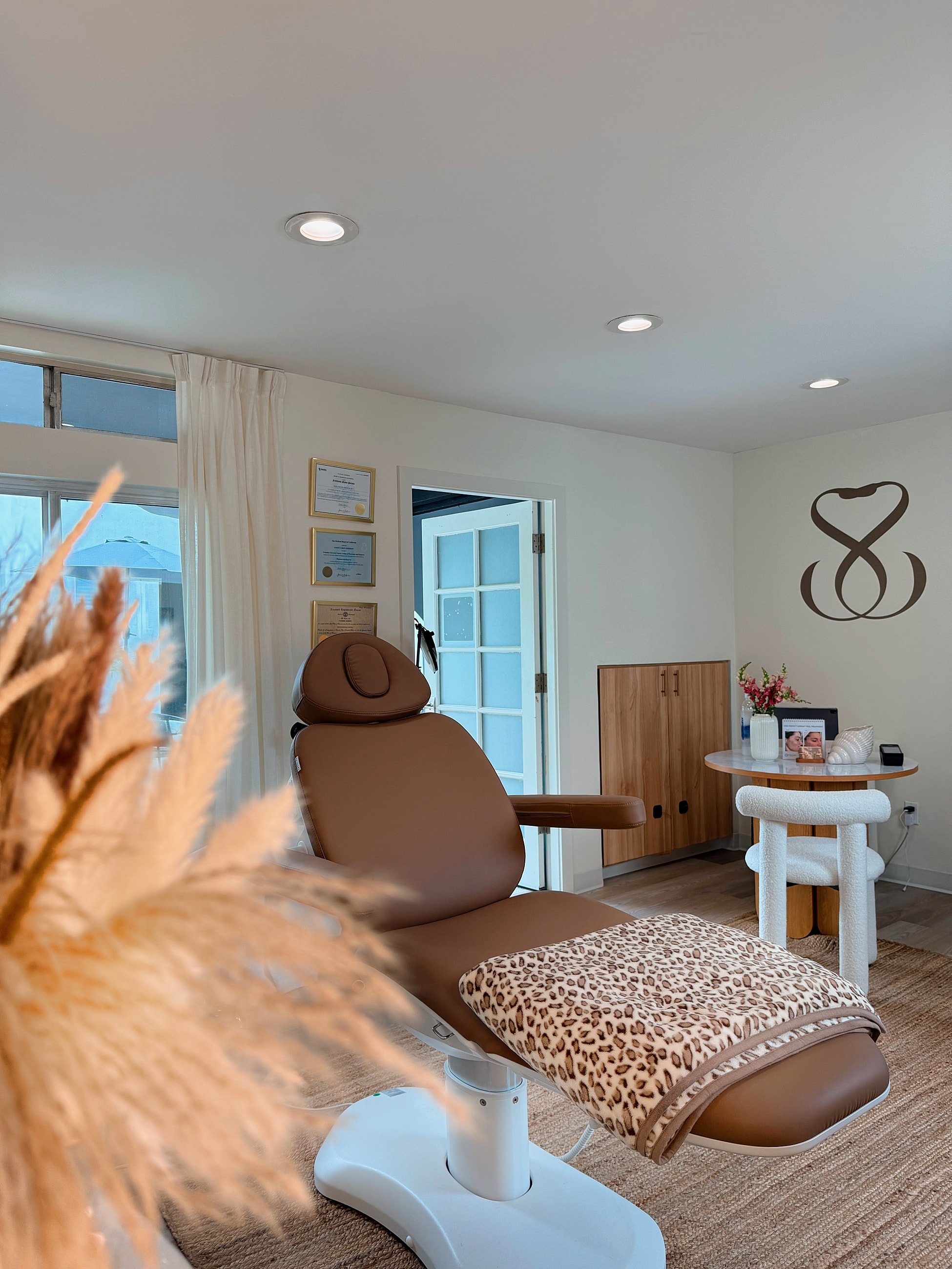 Woman holding "Coming Soon" spa announcement.